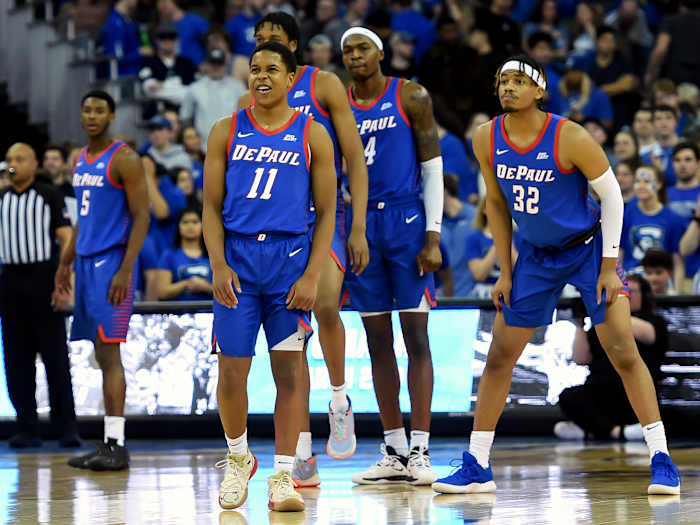 Feb 15, 2020; Omaha, Nebraska, USA; DePaul Blue Demons guard Charlie Moore (11) lead his teammates onto the court against the Creighton Bluejays in the first half at CHI Health Center Omaha.